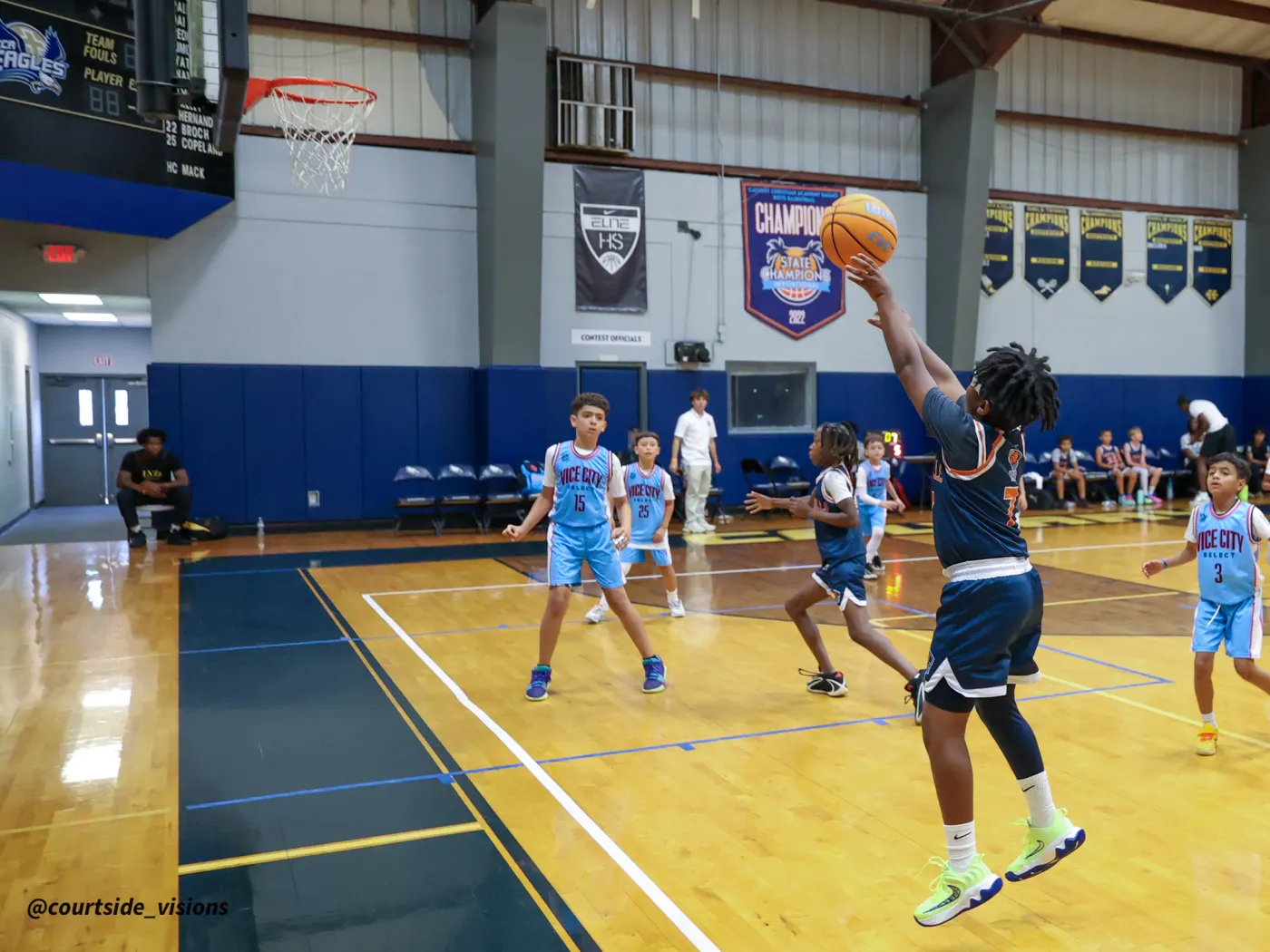 Youth athlete driving to the basket